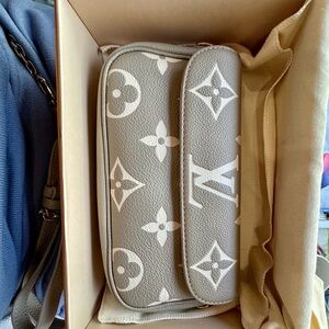 Louis Vuitton Authentic wallet with chain Ivy
